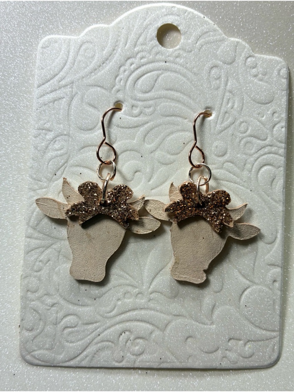 Handcrafted Beige Cow Head Earrings with Glitter Accent
